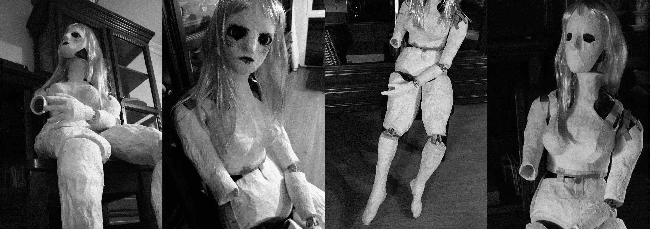 fotografía en blanco y negro de una muñeca de papel maché